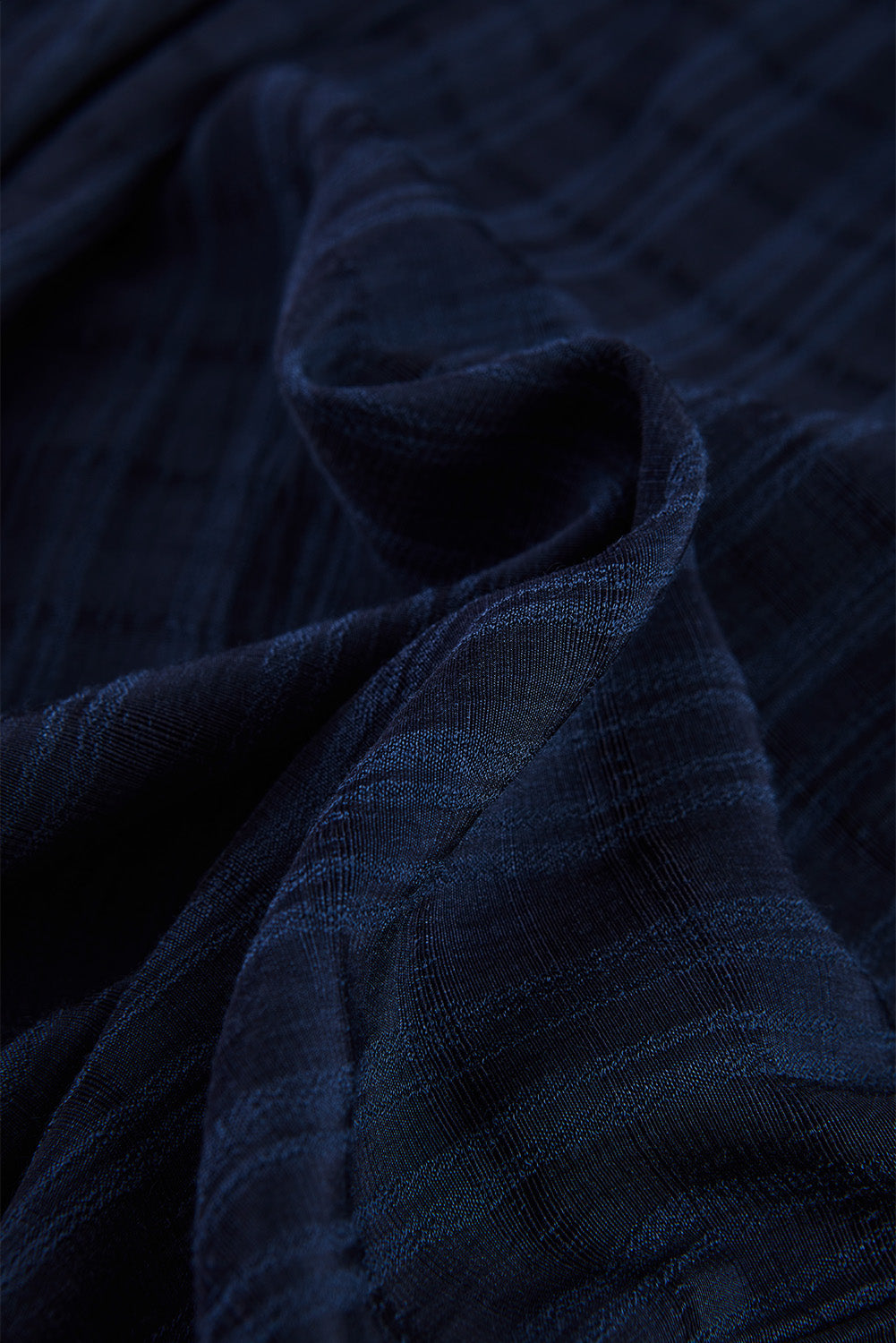 A stylish white plaid print loose V neck short sleeve shirt with slits, showcasing its trendy design and comfortable fit.