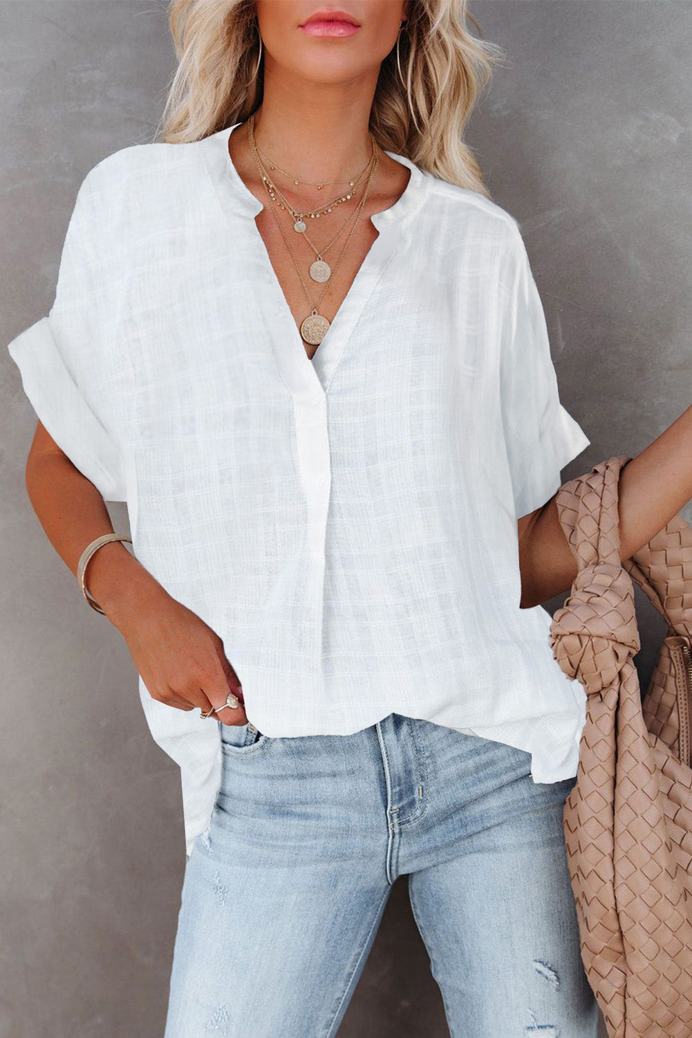 A stylish white plaid print loose V neck short sleeve shirt with slits, showcasing its trendy design and comfortable fit.