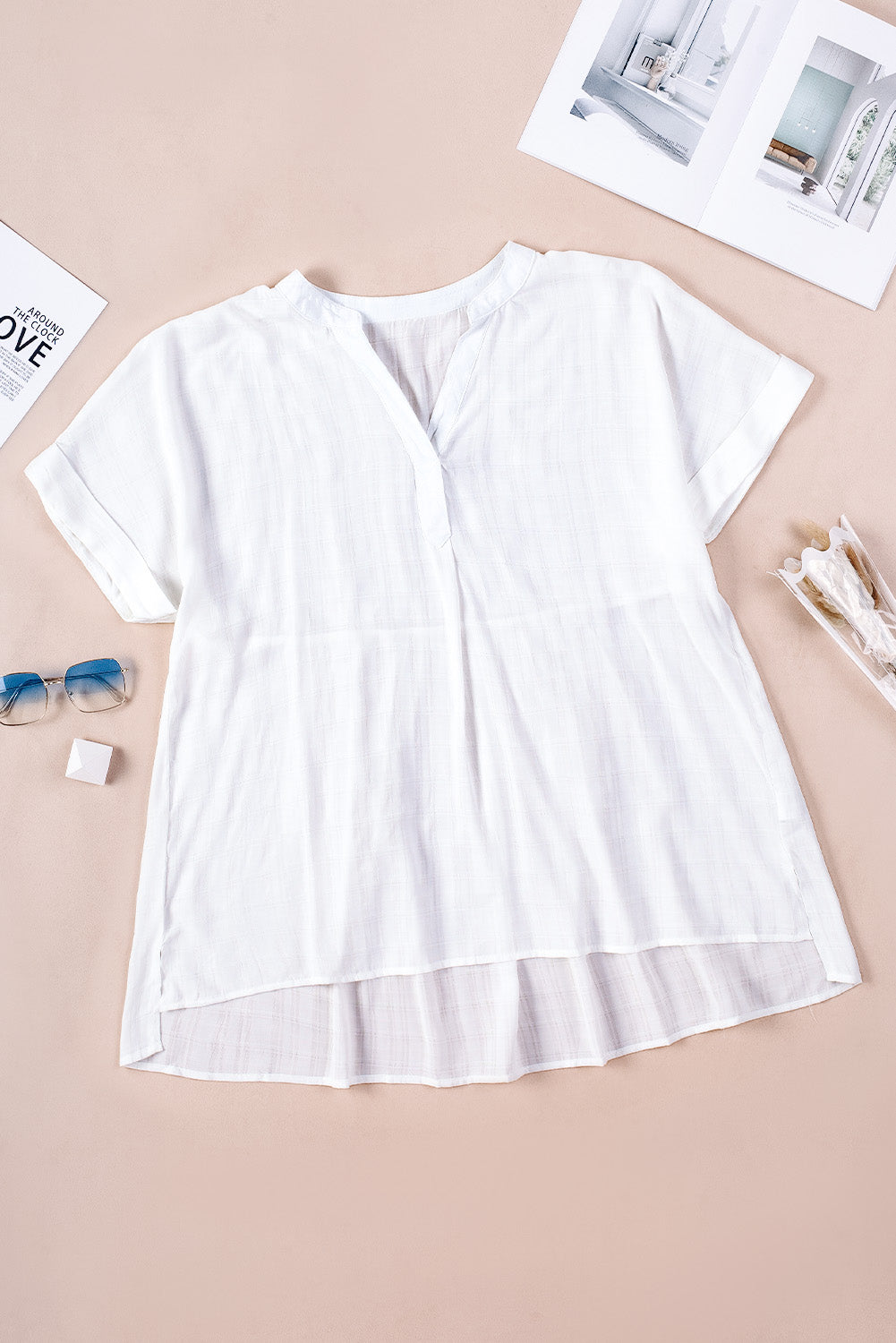 A stylish white plaid print loose V neck short sleeve shirt with slits, showcasing its trendy design and comfortable fit.