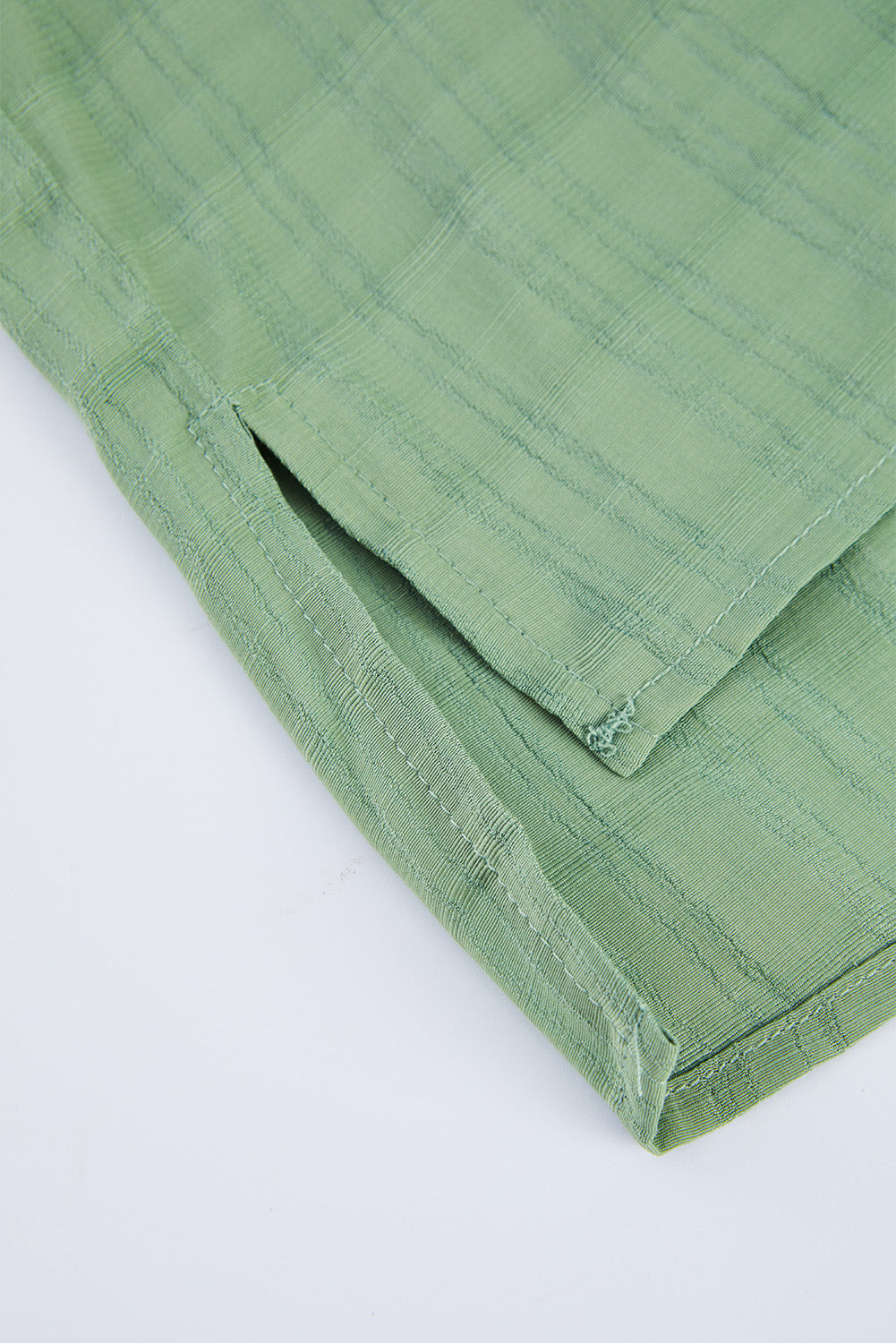 A stylish white plaid print loose V neck short sleeve shirt with slits, showcasing its trendy design and comfortable fit.