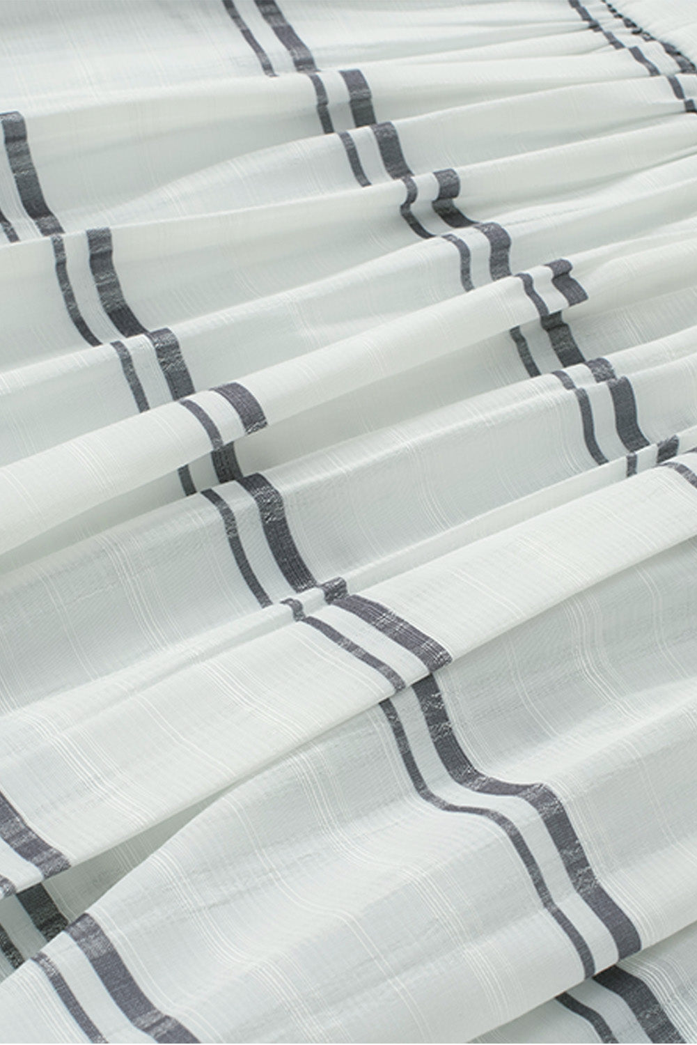 A stylish white plaid print loose V neck short sleeve shirt with slits, showcasing its trendy design and comfortable fit.