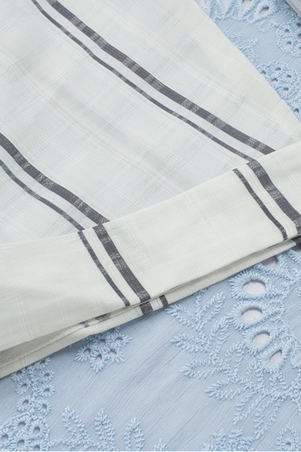 A stylish white plaid print loose V neck short sleeve shirt with slits, showcasing its trendy design and comfortable fit.