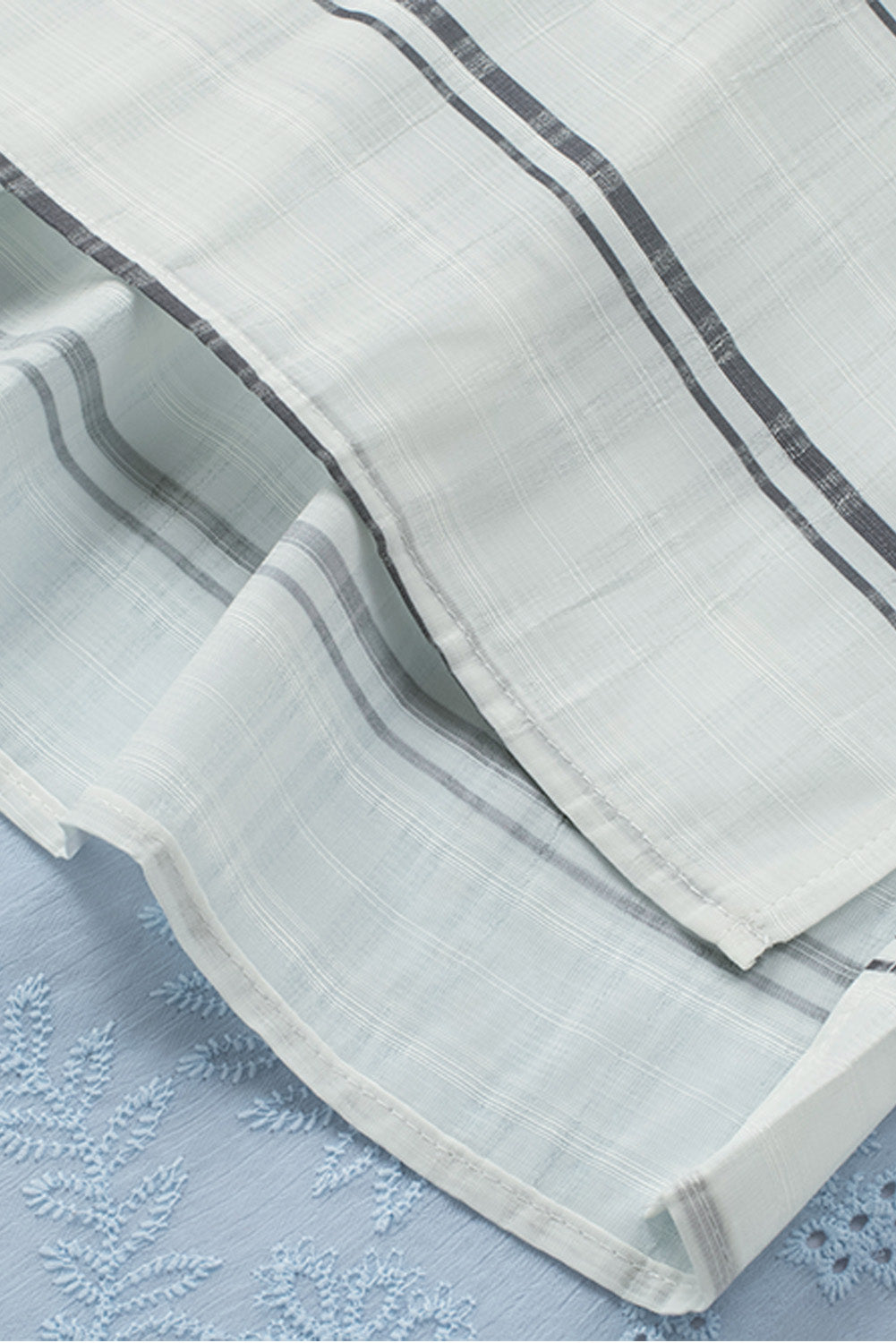 A stylish white plaid print loose V neck short sleeve shirt with slits, showcasing its trendy design and comfortable fit.