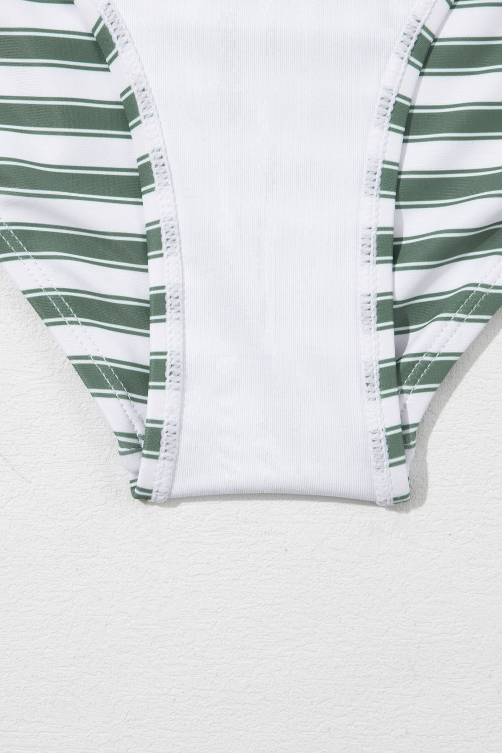 White Stripe Zipped Cut Out Racer Back High Waisted Bikini displayed on a mannequin, showcasing its stylish design and high-waisted fit.