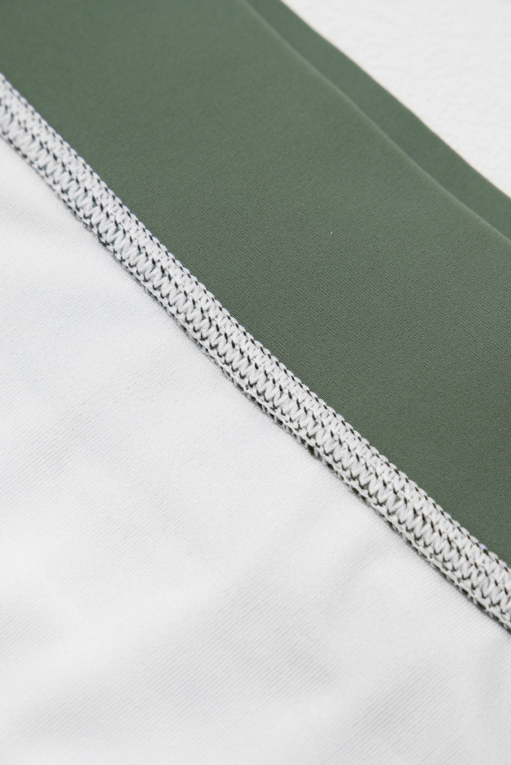 White Stripe Zipped Cut Out Racer Back High Waisted Bikini displayed on a mannequin, showcasing its stylish design and high-waisted fit.