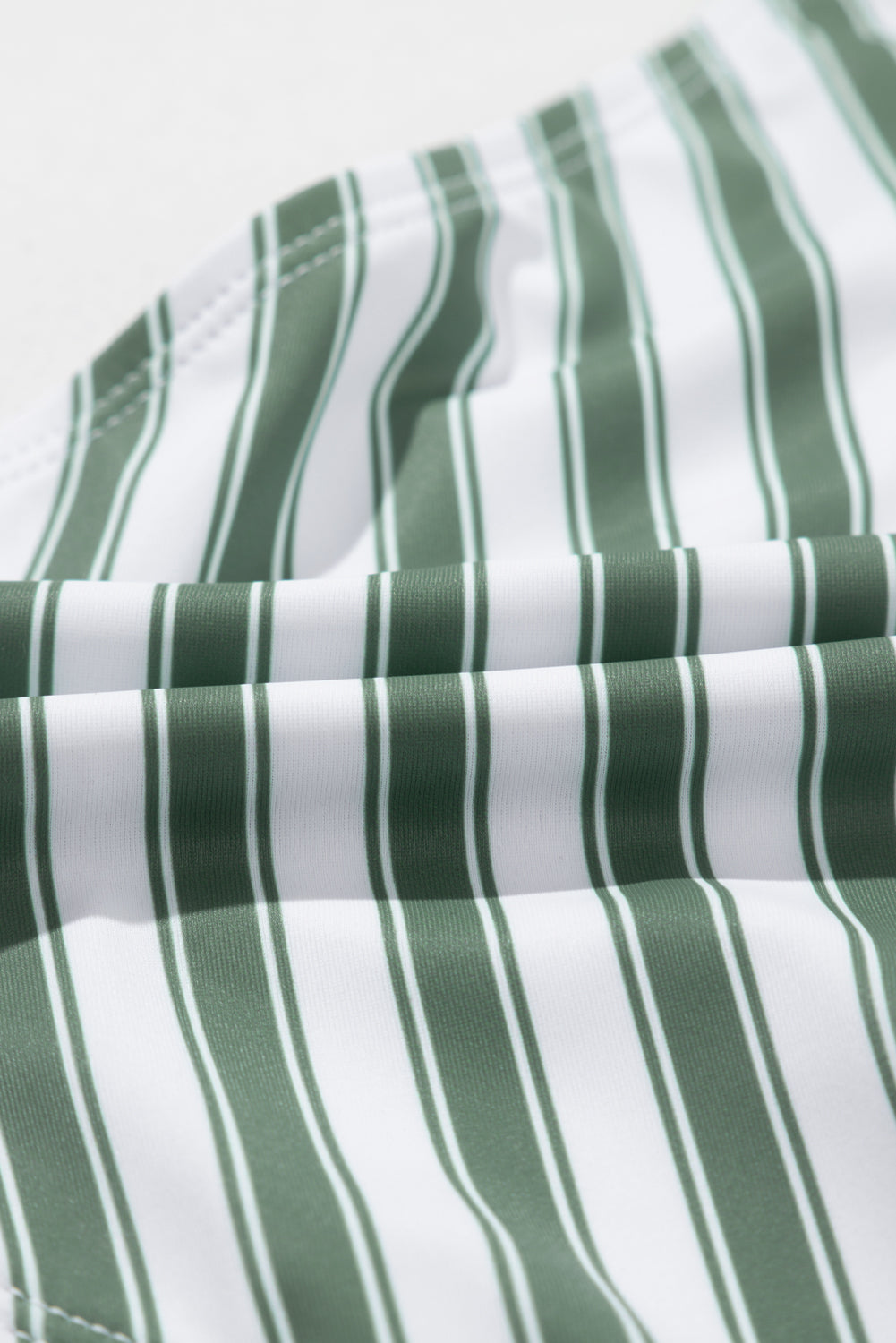 White Stripe Zipped Cut Out Racer Back High Waisted Bikini displayed on a mannequin, showcasing its stylish design and high-waisted fit.