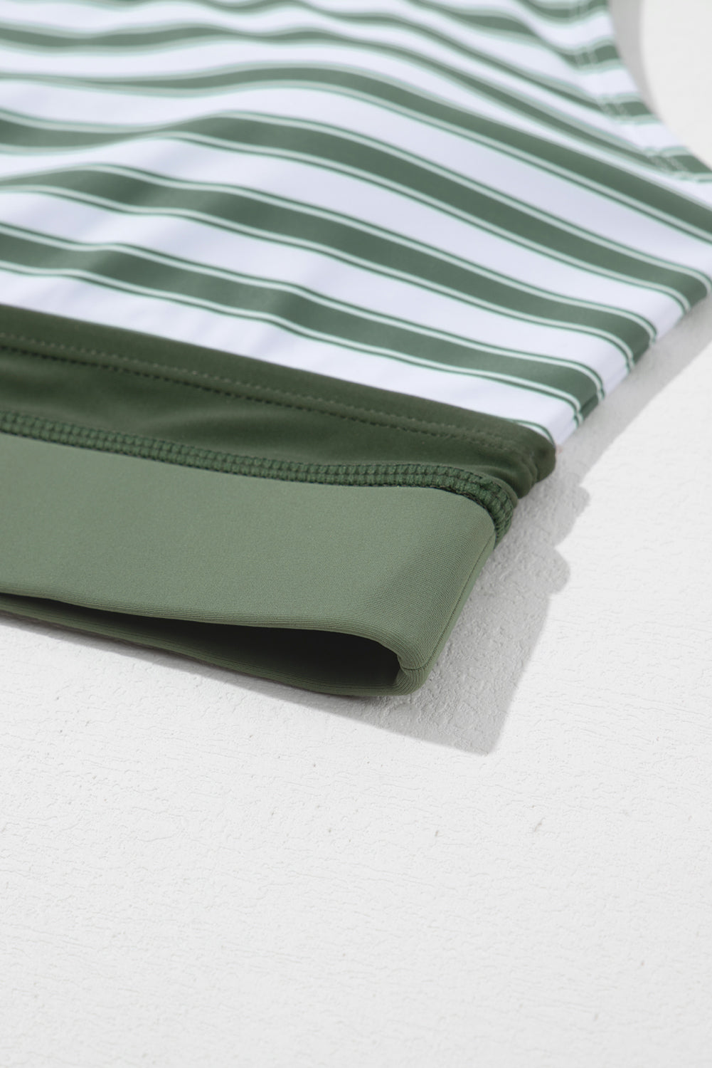 White Stripe Zipped Cut Out Racer Back High Waisted Bikini displayed on a mannequin, showcasing its stylish design and high-waisted fit.