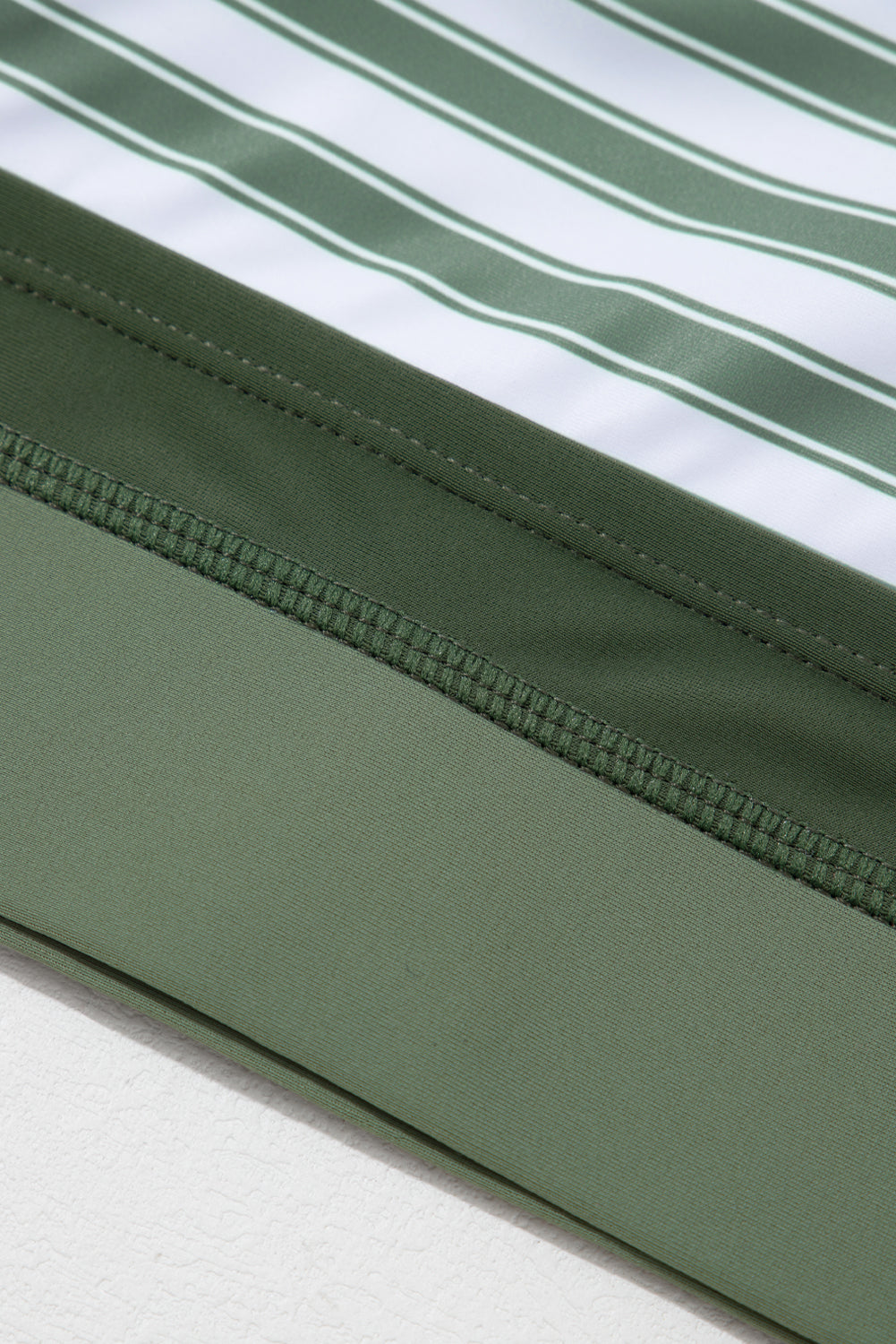 White Stripe Zipped Cut Out Racer Back High Waisted Bikini displayed on a mannequin, showcasing its stylish design and high-waisted fit.