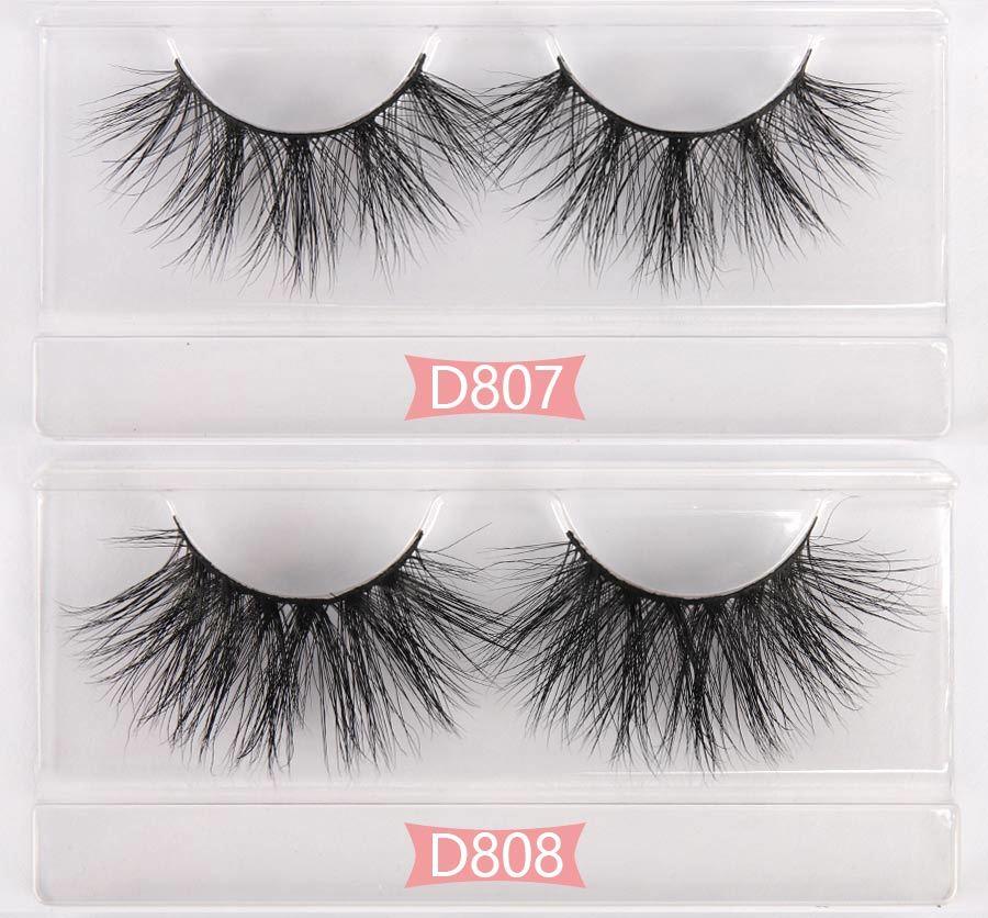 A collection of 50 pairs of dramatic 3D mink eyelashes in criss-cross style, showcasing their luxurious texture and volume.