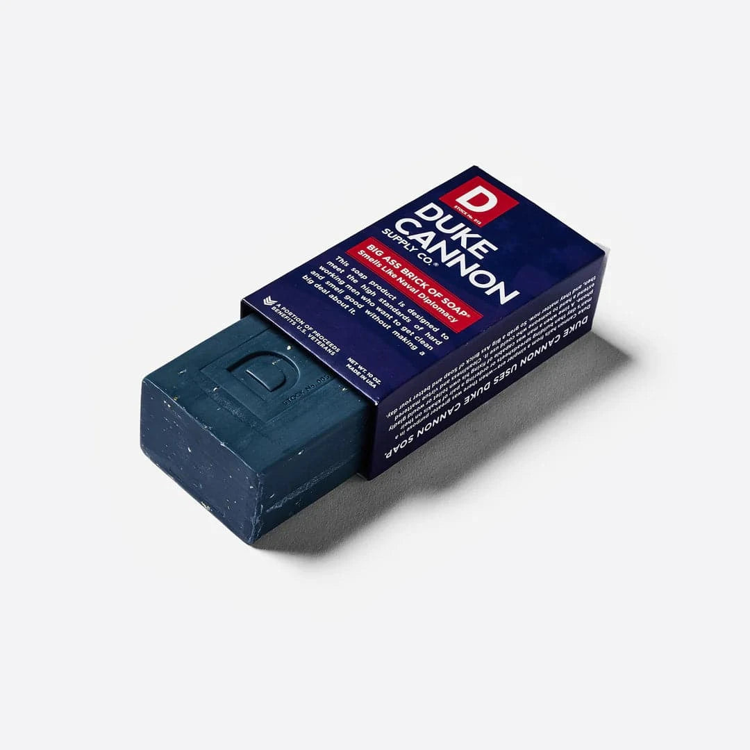 WWII-era Big Ass Brick of Soap in blue, featuring naval-themed packaging and steel cut grains for grip.