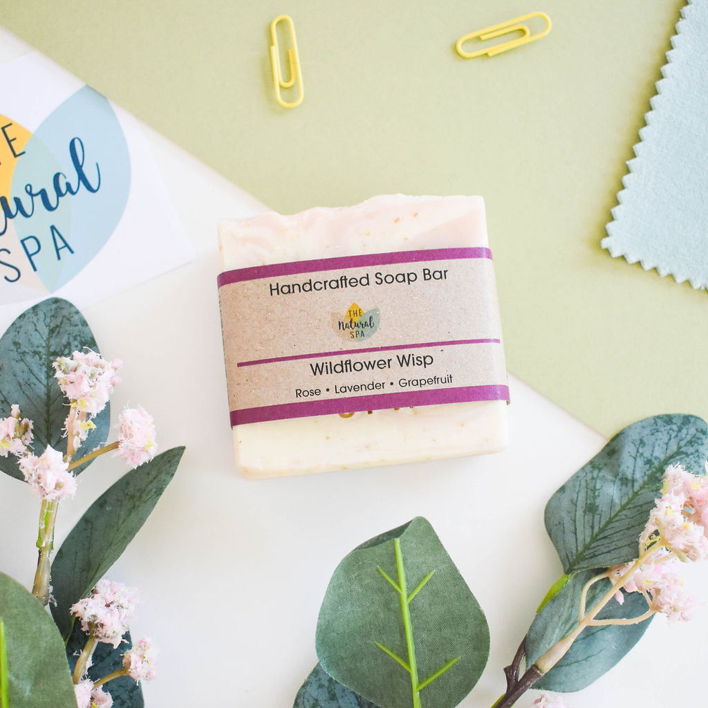 Wild Flower Wisp cold process soap bar featuring rose, lavender, and grapefruit scents, elegantly designed for a luxurious bathing experience.