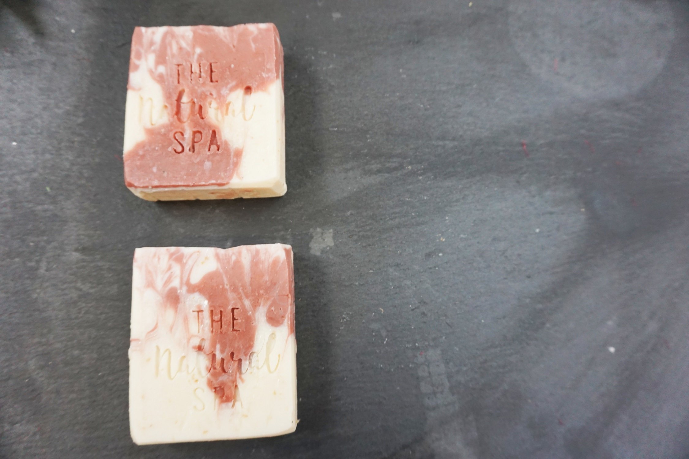 Wild Flower Wisp cold process soap bar featuring rose, lavender, and grapefruit scents, elegantly designed for a luxurious bathing experience.