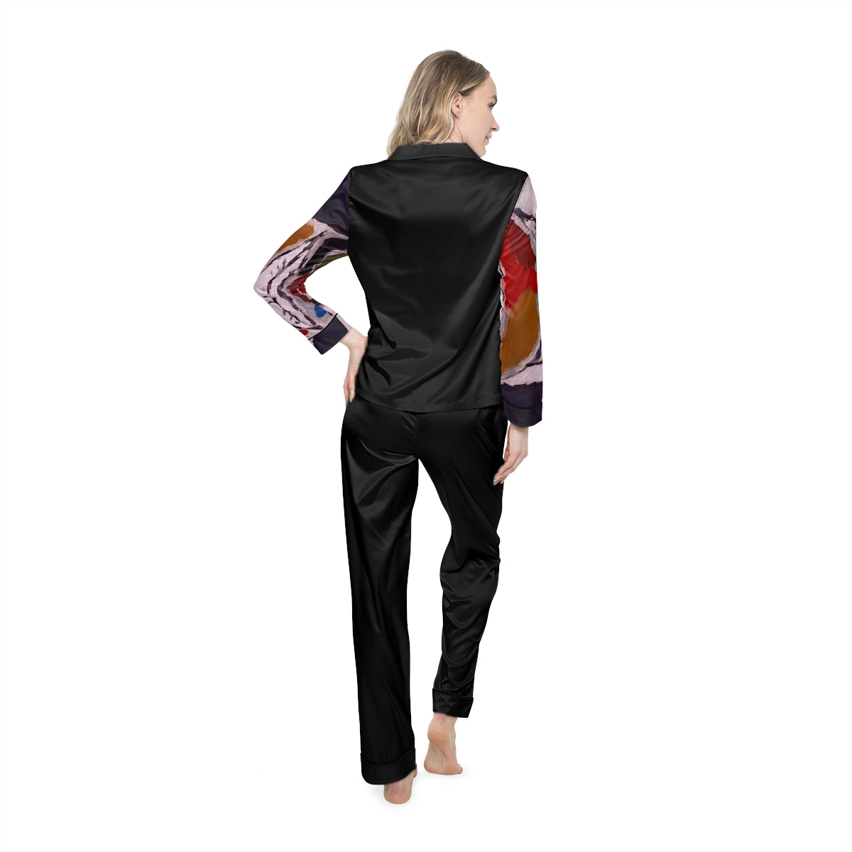 A pair of women's satin pajamas featuring a soft fabric blend, customizable design, notch lapel collar, and drawstring waist in a stylish setting.