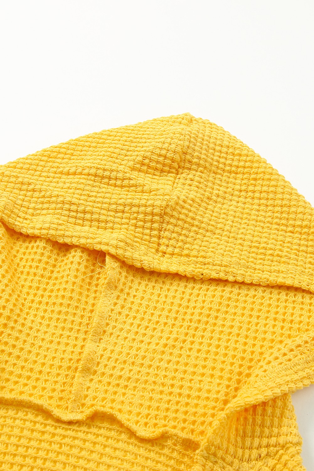 A stylish yellow V neck drop shoulder hooded top with frill detail, showcasing a relaxed fit and long sleeves, perfect for casual wear.