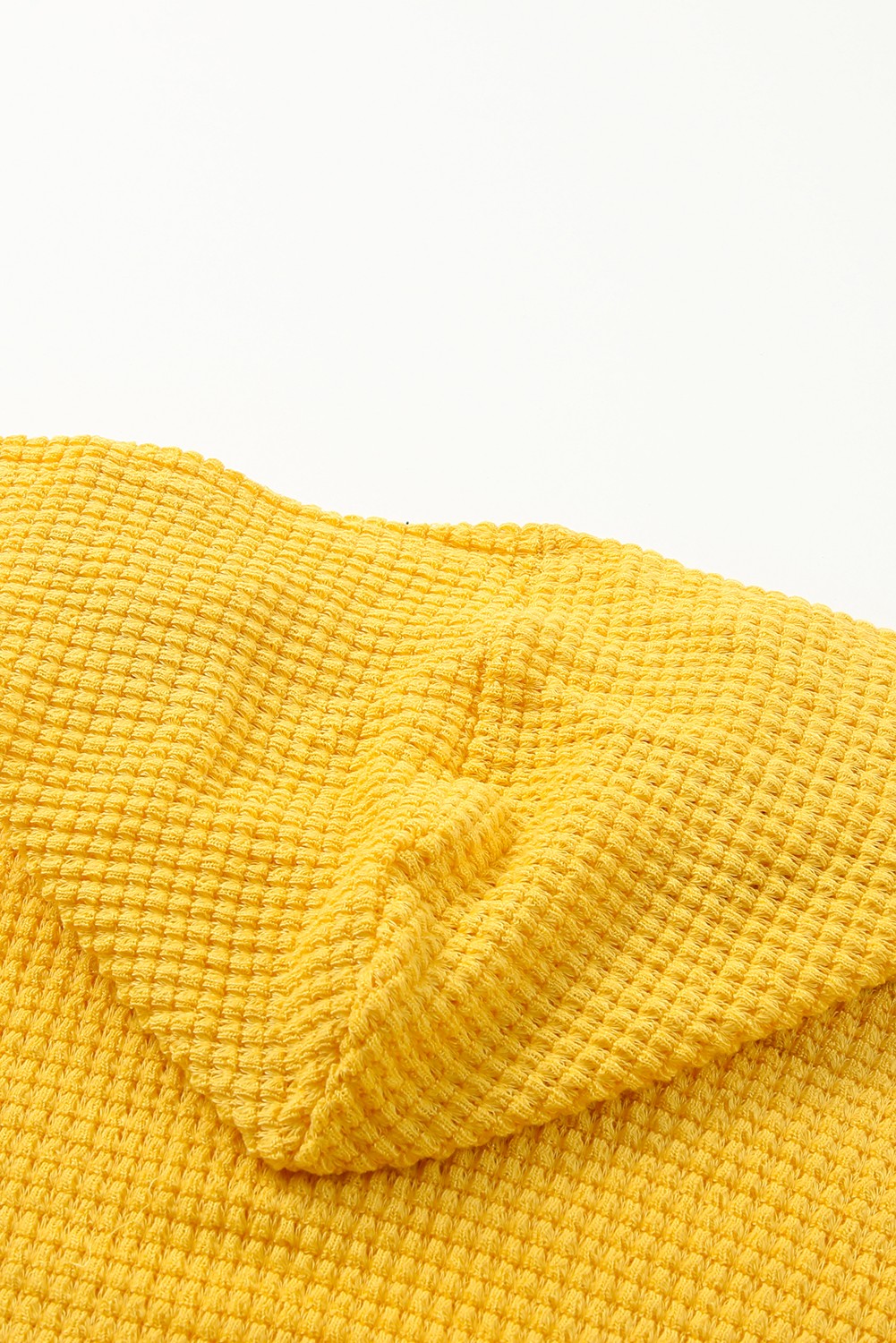 A stylish yellow V neck drop shoulder hooded top with frill detail, showcasing a relaxed fit and long sleeves, perfect for casual wear.