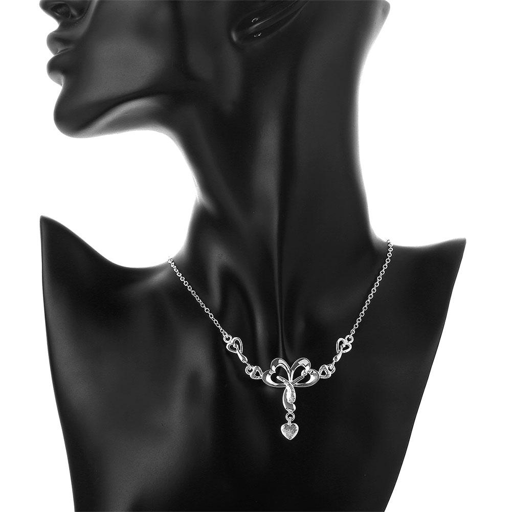 Elegant Zoey Necklace in 18K white gold plating adorned with sparkling crystals, displayed in a white gift box.