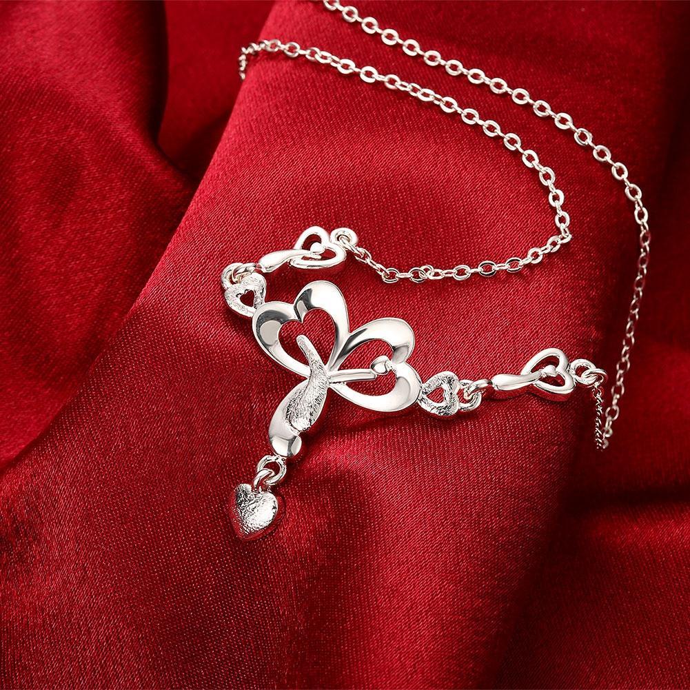 Elegant Zoey Necklace in 18K white gold plating adorned with sparkling crystals, displayed in a white gift box.