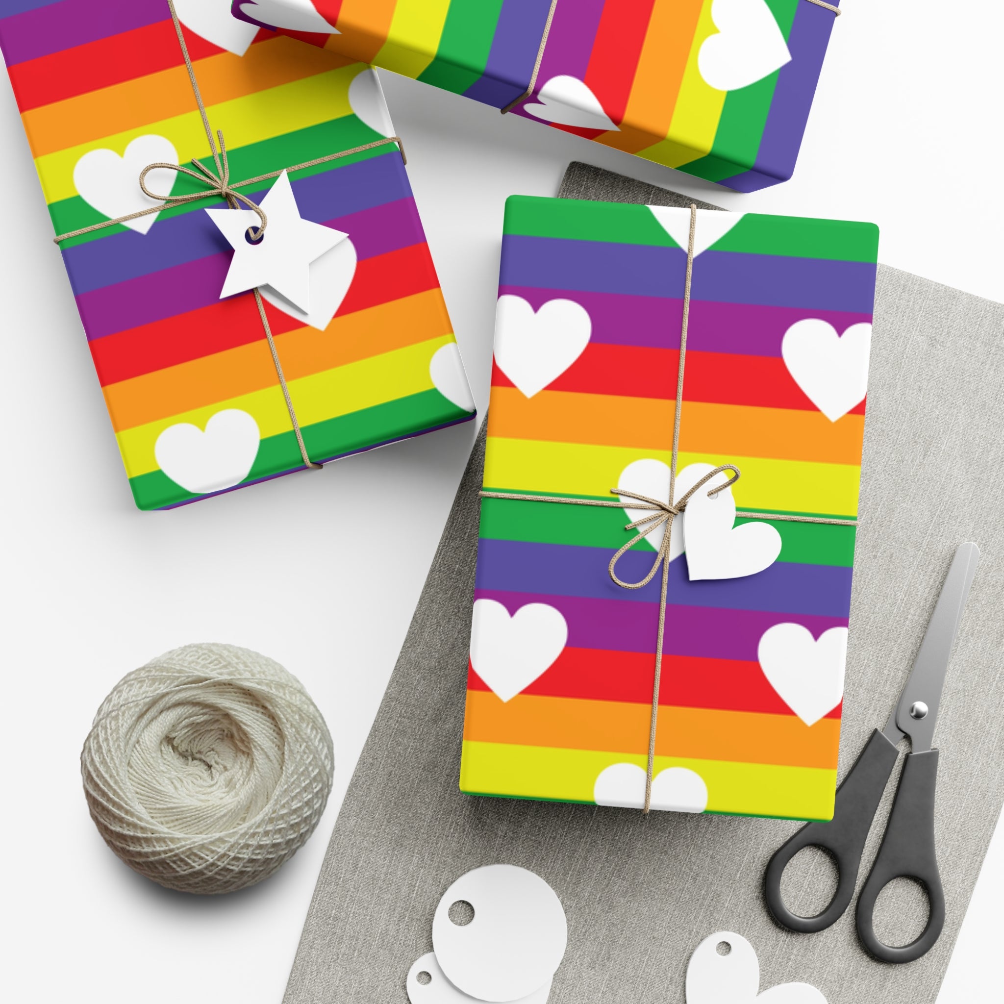 Vibrant Pride Wrapping Paper featuring rainbow and heart designs, available in matte and satin finishes.
