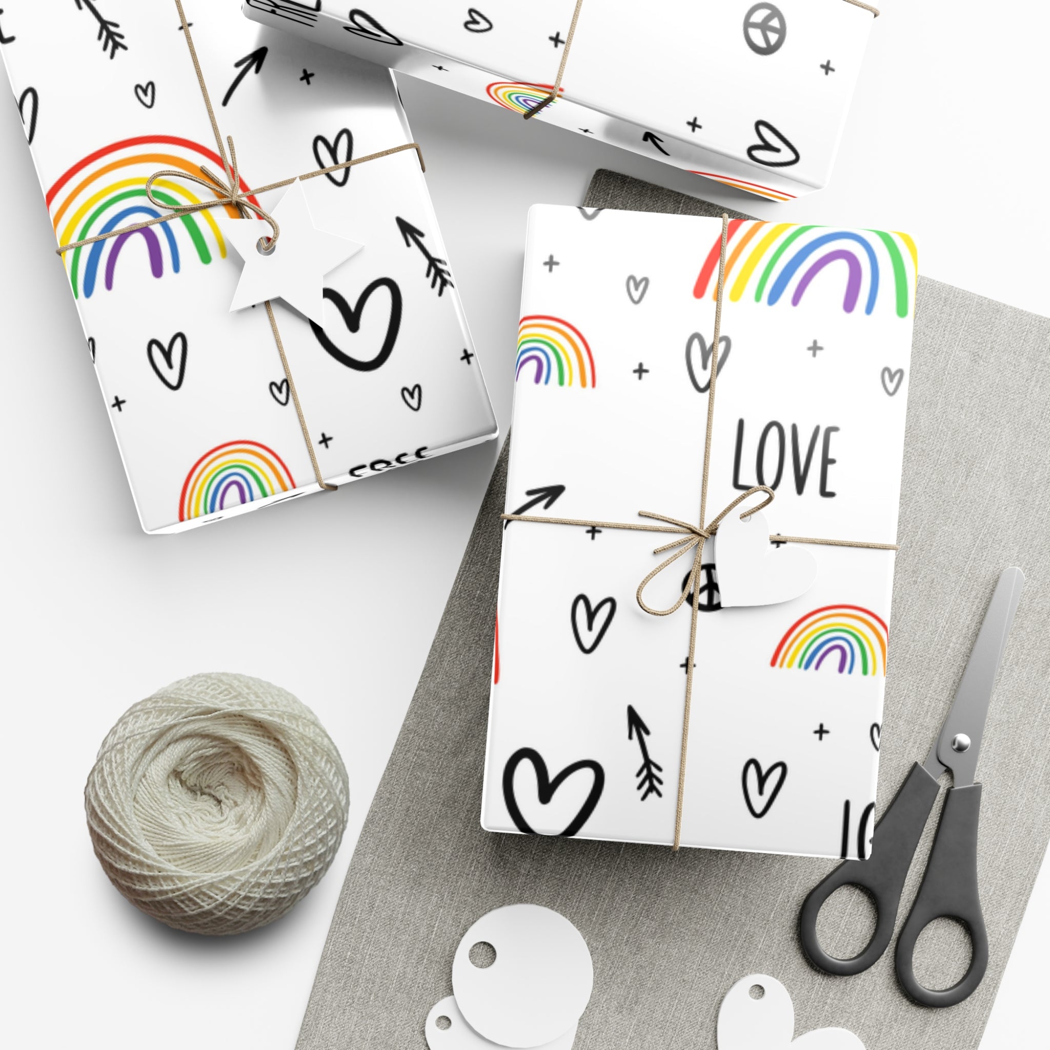 Vibrant Pride Wrapping Paper featuring rainbow and heart designs in satin and matte finishes.