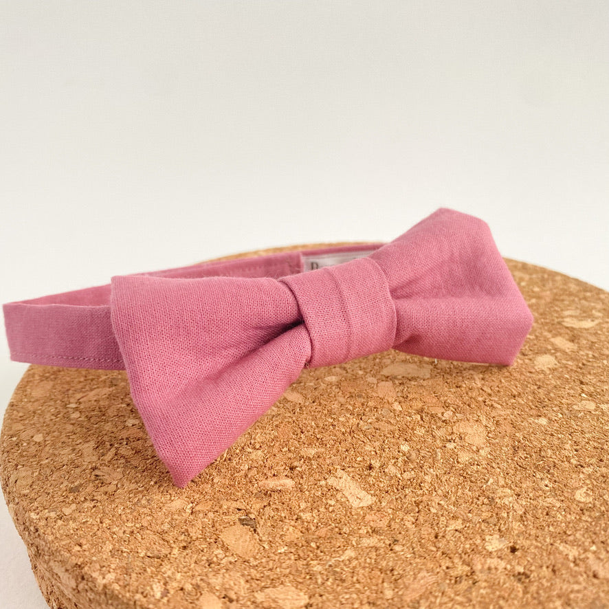 Dusty Rose Boys Bow Tie, handmade in England, featuring a pre-tied design with velcro fastening, perfect for special occasions.