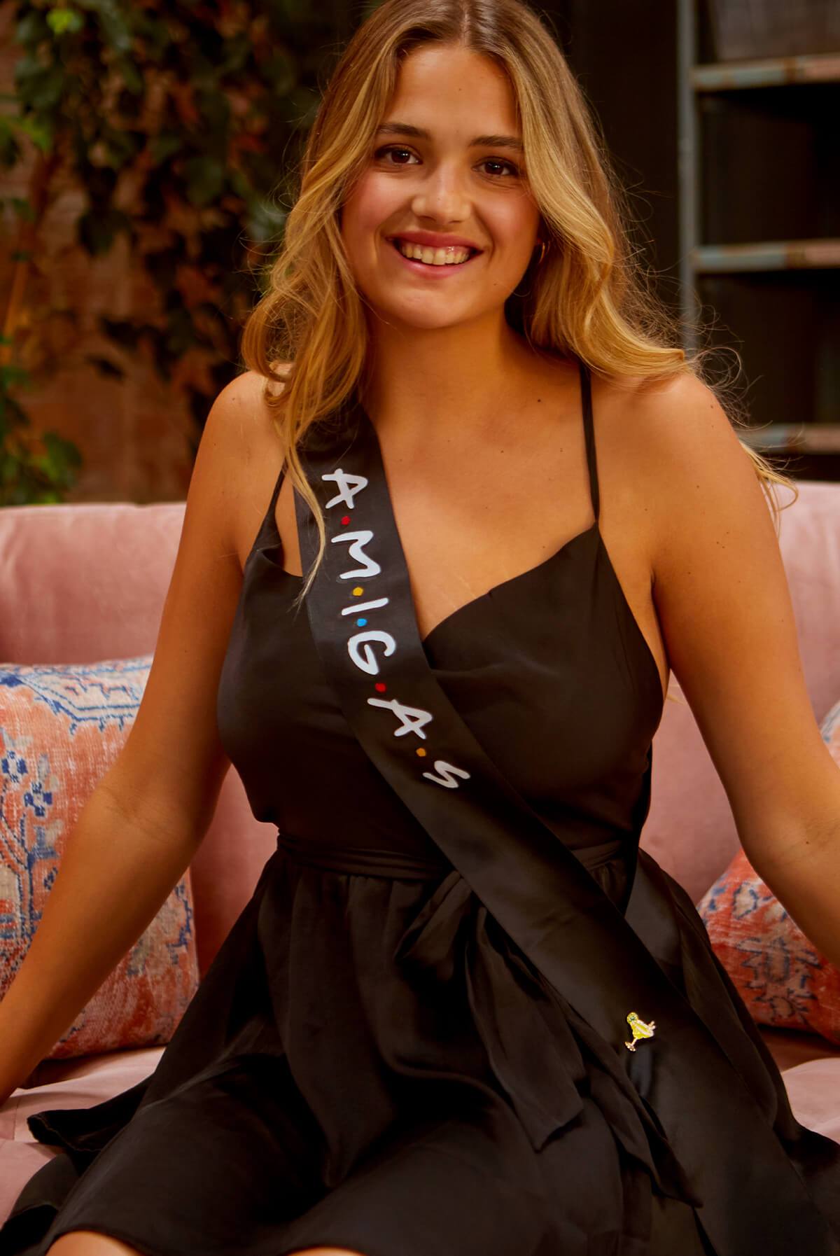 A set of FRIENDS bachelorette party sashes featuring shiny leopard foil design on white satin ribbon, perfect for brides and their amigas.