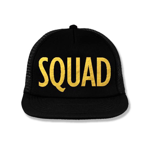 SQUAD Snapback Trucker Hat in black with gold foil print, featuring a structured high-profile design and adjustable snapback closure.