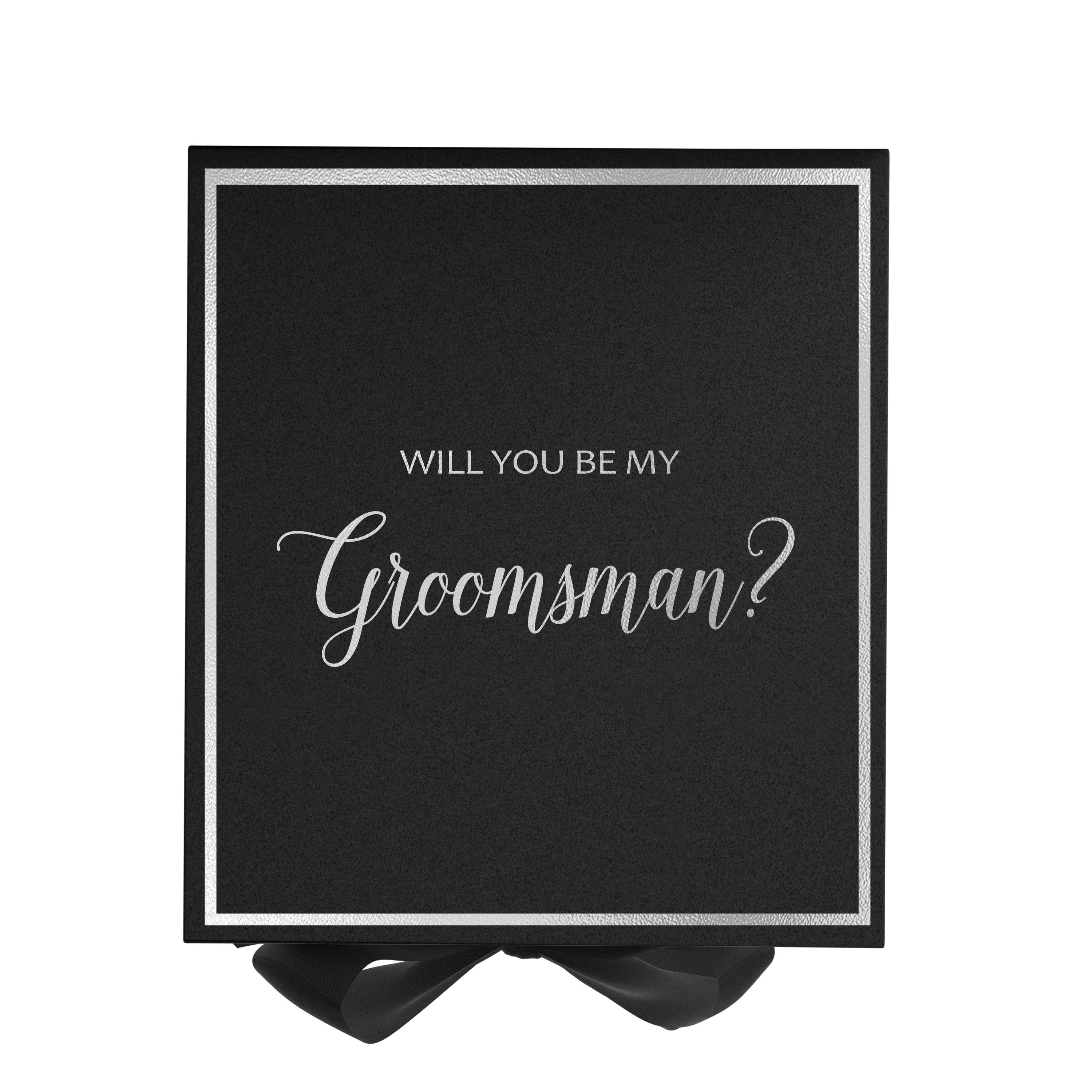 Elegant black groomsman proposal box with metallic writing and a black bow, showcasing its luxurious design.