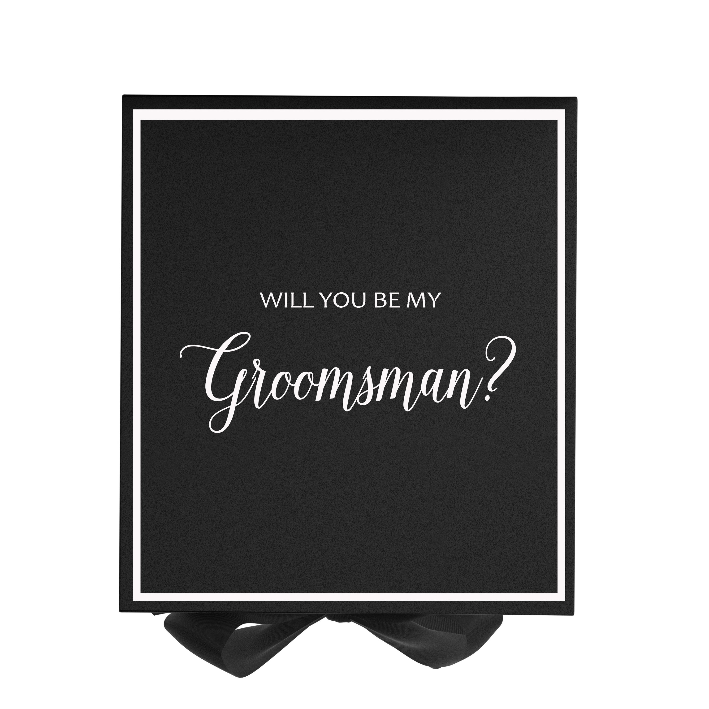 Elegant black groomsman proposal box with metallic writing and a black bow, showcasing its luxurious design.