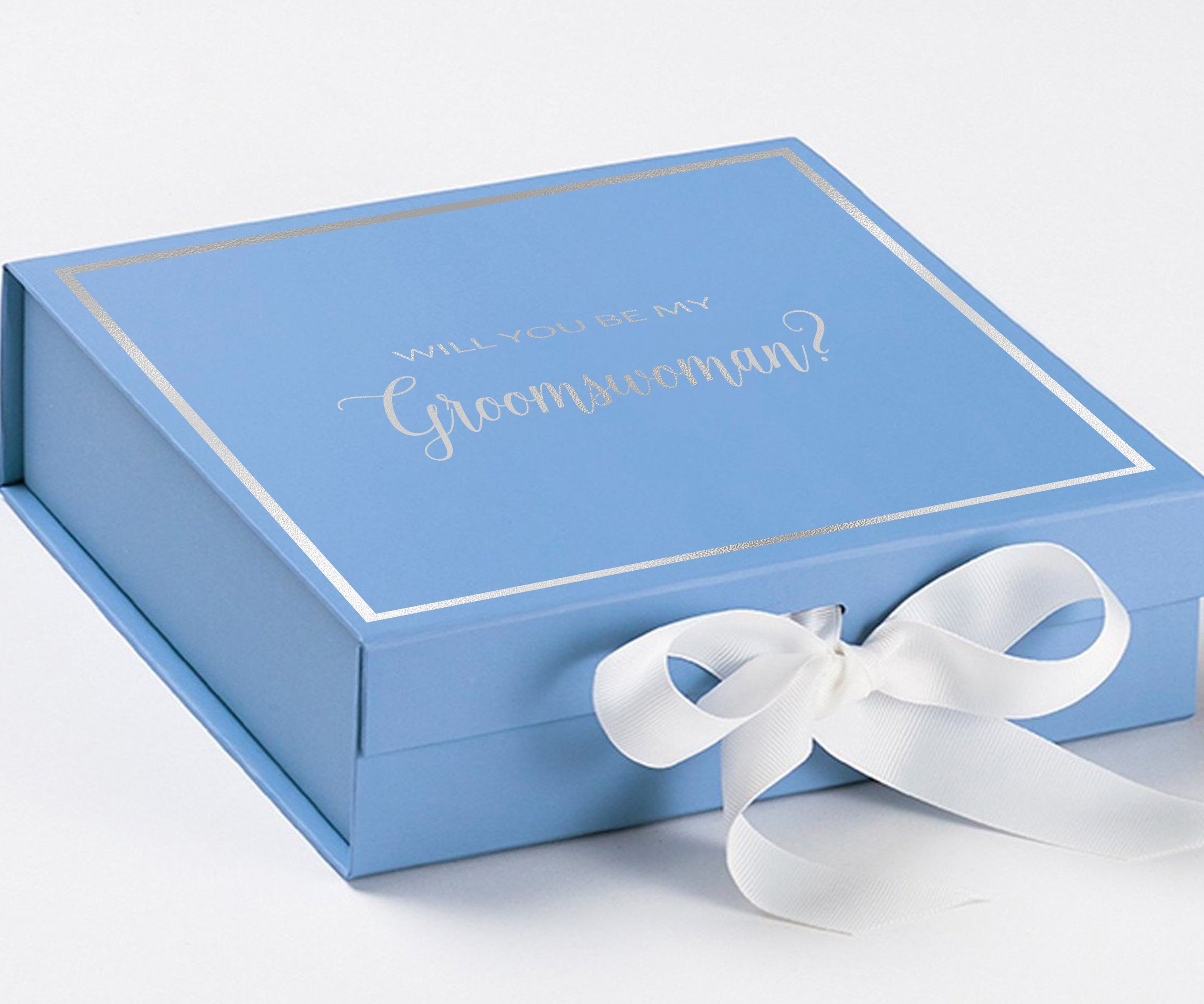 Light blue proposal box with white bow and metallic writing, perfect for asking a groomswoman.