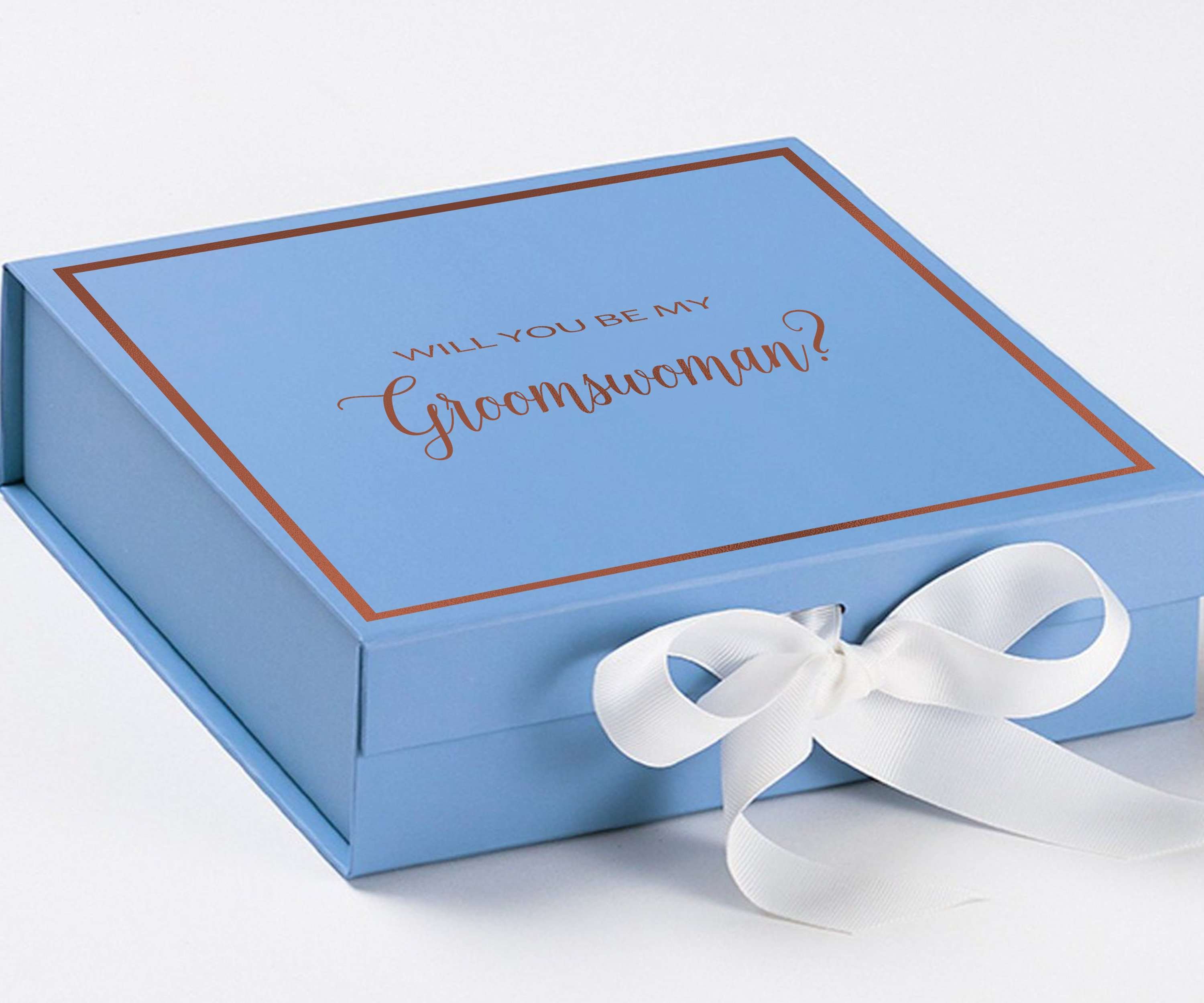 Light blue proposal box with white bow and metallic writing, perfect for asking a groomswoman.