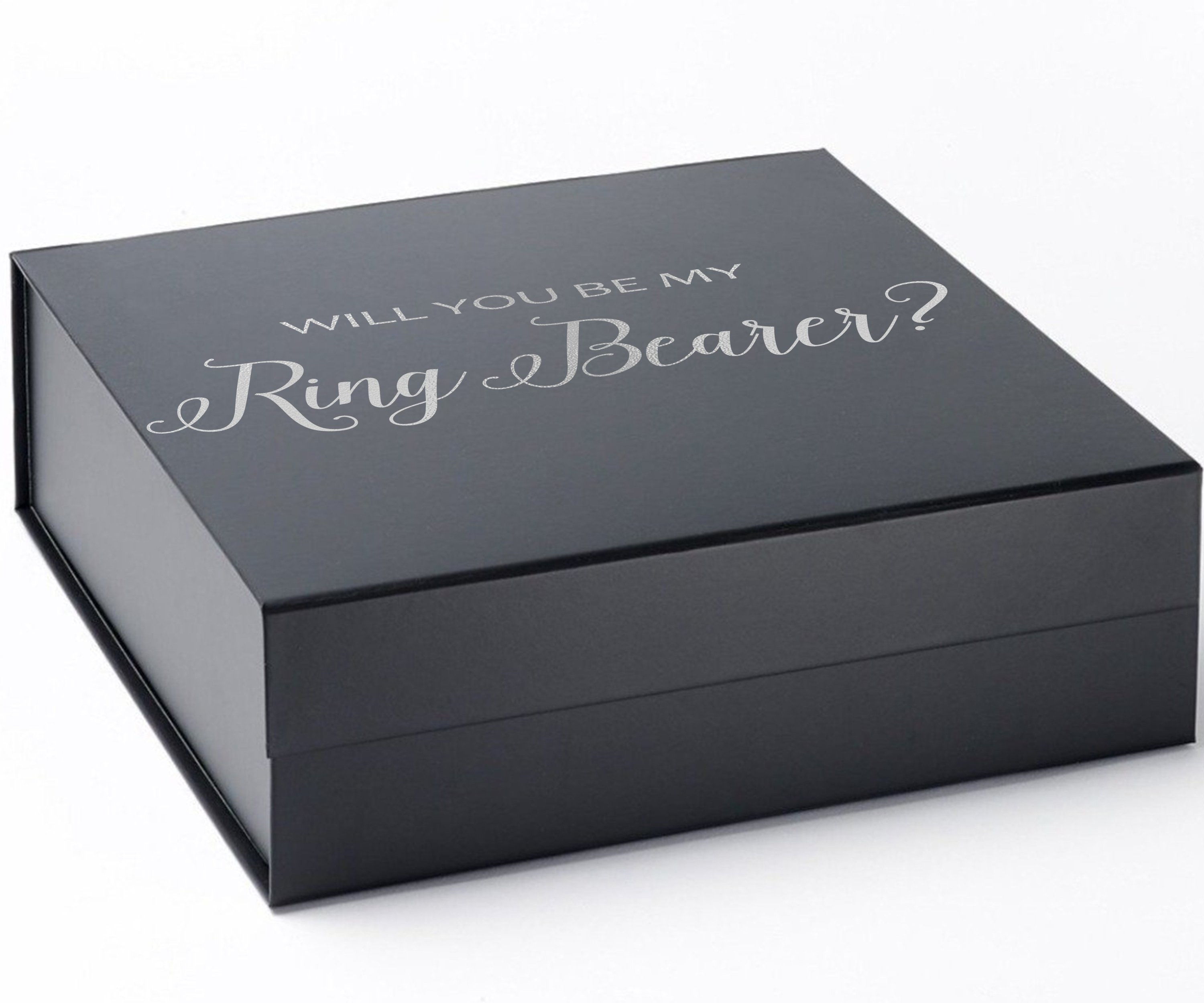 Elegant black proposal box with metallic writing, showcasing a sleek design without borders or ribbons.