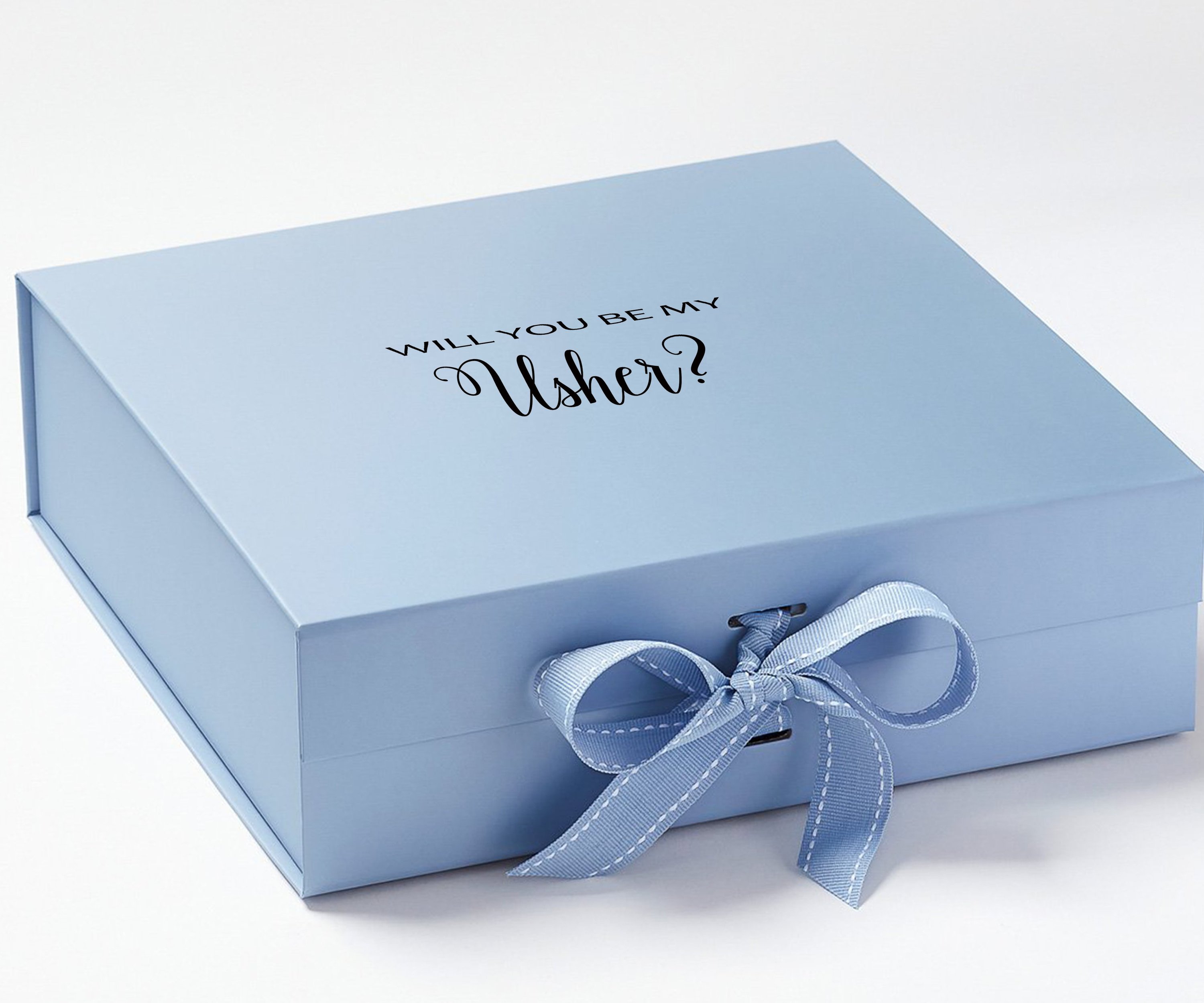 Light blue proposal box with metallic writing and matching bow, showcasing its elegant design.