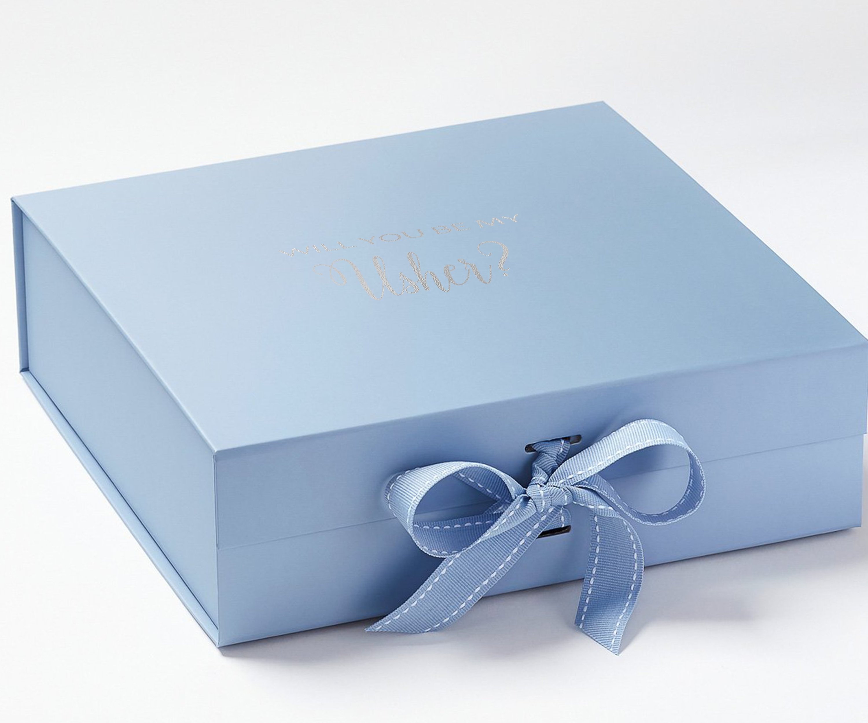 Light blue proposal box with metallic writing and matching bow, showcasing its elegant design.
