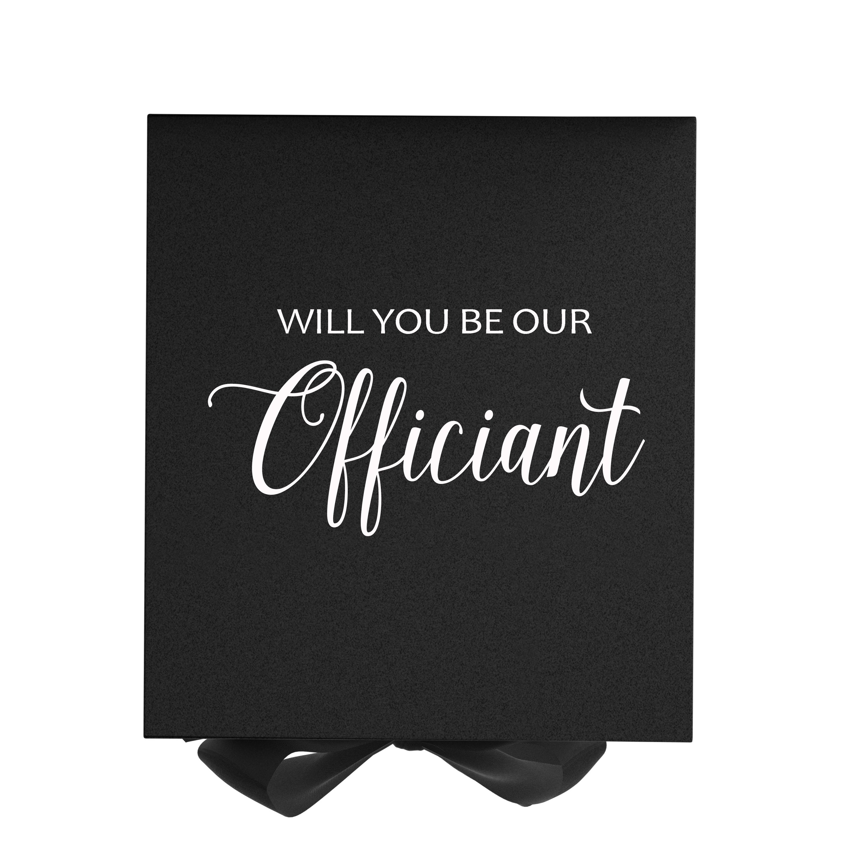 Elegant black proposal box with metallic writing and a black bow, showcasing a luxurious design for officiant proposals.