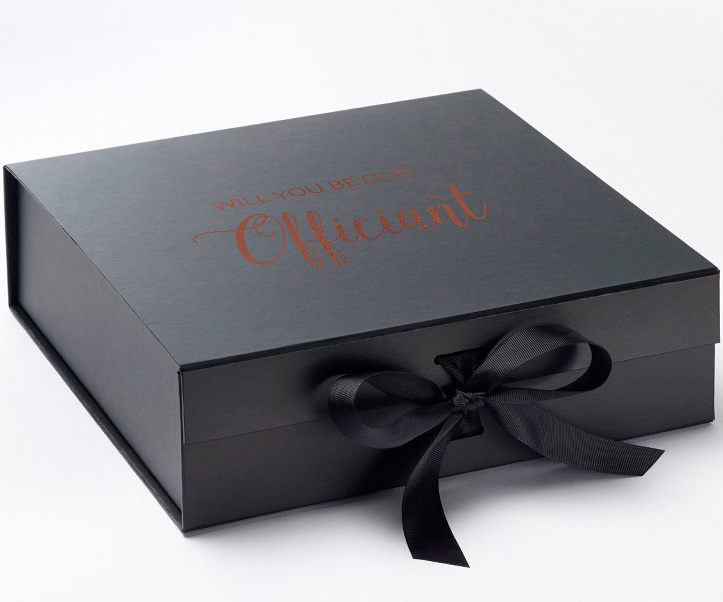 Elegant black proposal box with metallic writing and a black bow, showcasing a luxurious design for officiant proposals.
