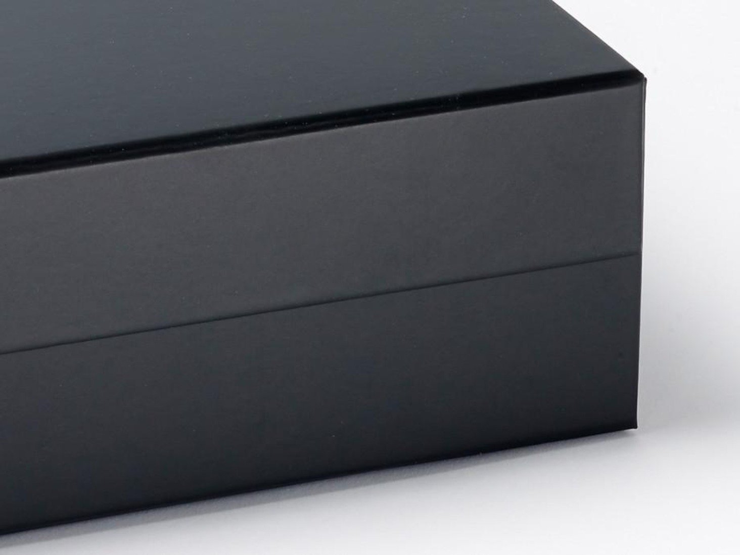 Elegant black proposal box with metallic writing on the lid, showcasing a sleek design without ribbon.