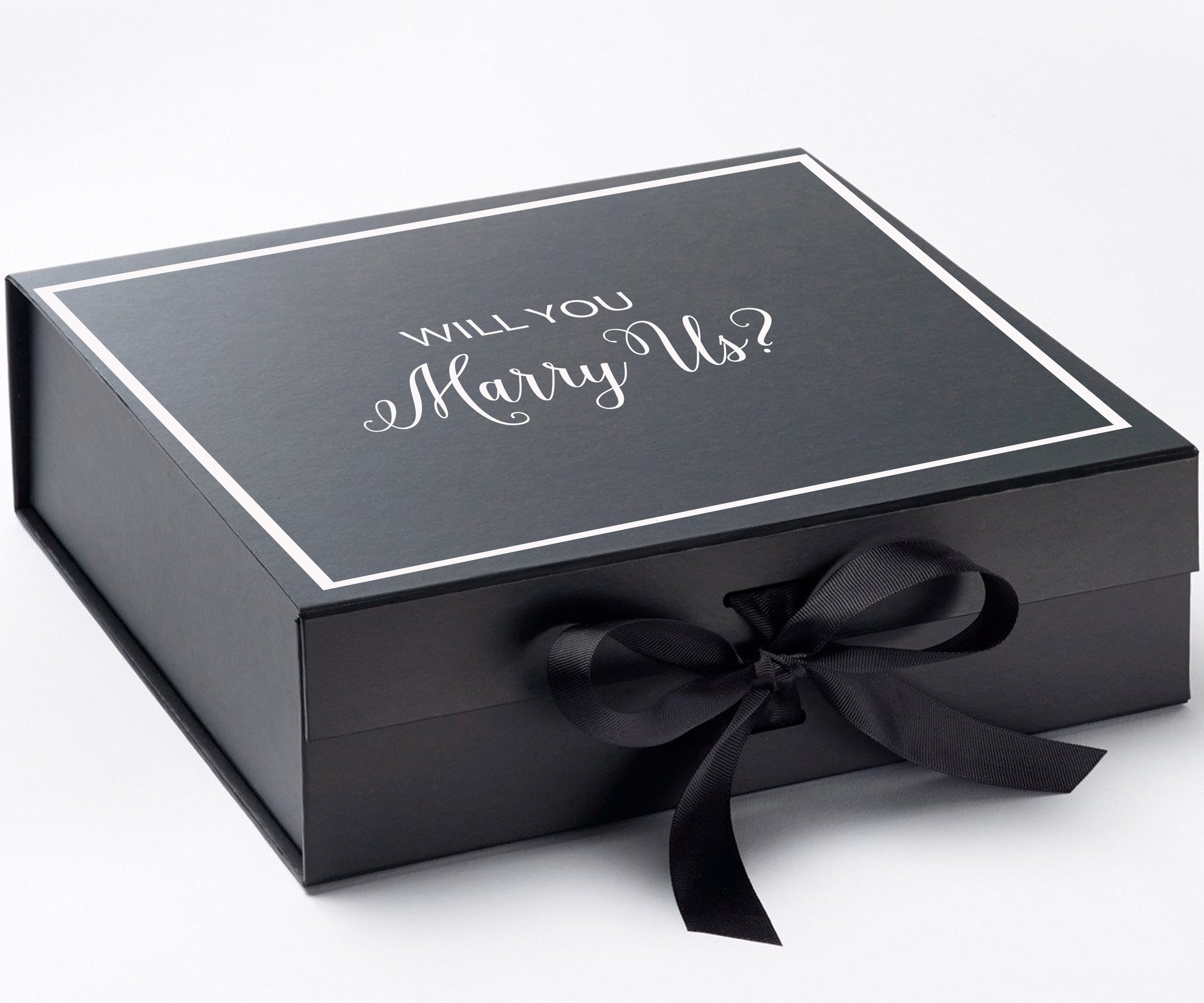 Elegant black proposal box with metallic writing and a black bow, perfect for engagement proposals.
