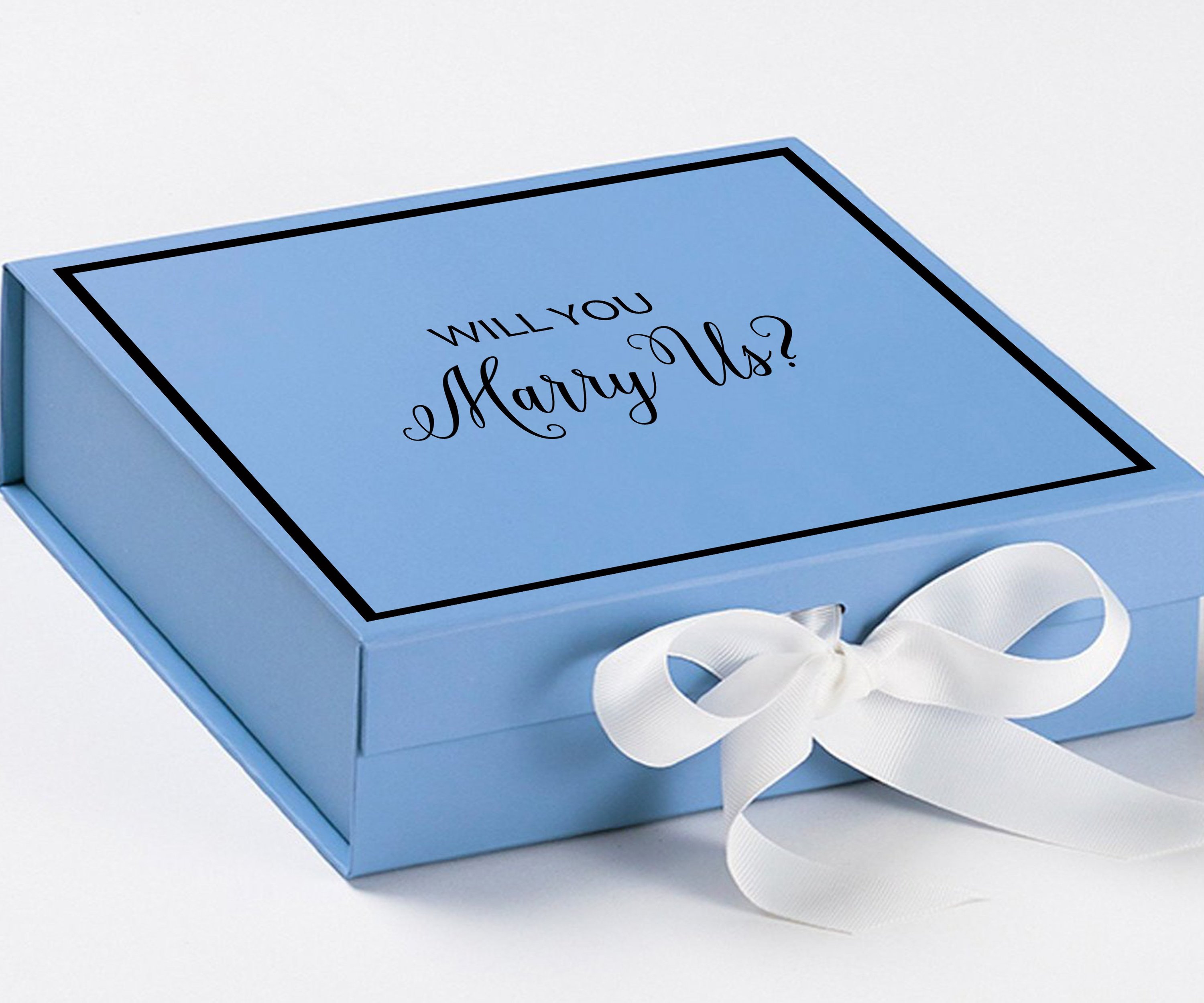 Light blue proposal box with white bow and metallic writing, perfect for engagement gifts.