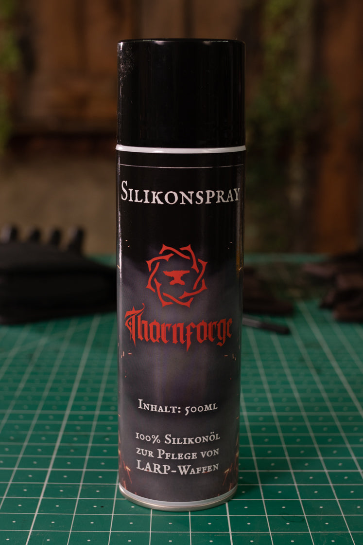 500ml silicone spray canister designed for maintaining latex LARP weapons, featuring a sleek design and clear labeling.