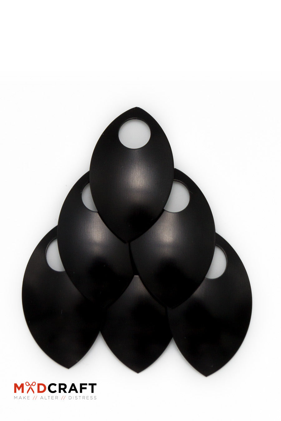 A collection of black aluminum scales, lightweight and perfect for armor customization, displayed in a neat arrangement.