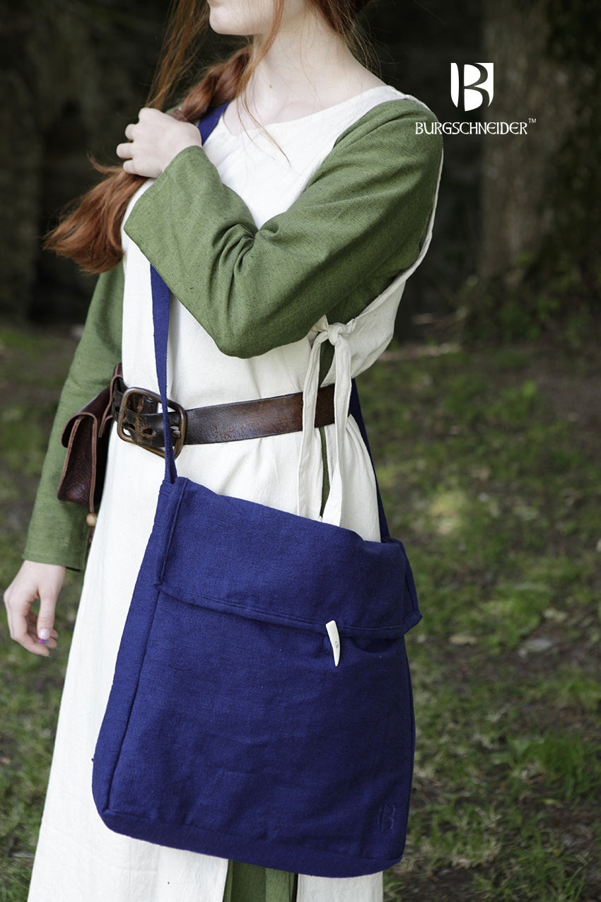 Bag Ehwaz Blue, a medieval-style bag made of unkempt cotton, featuring a long strap and coarse fabric for authenticity.