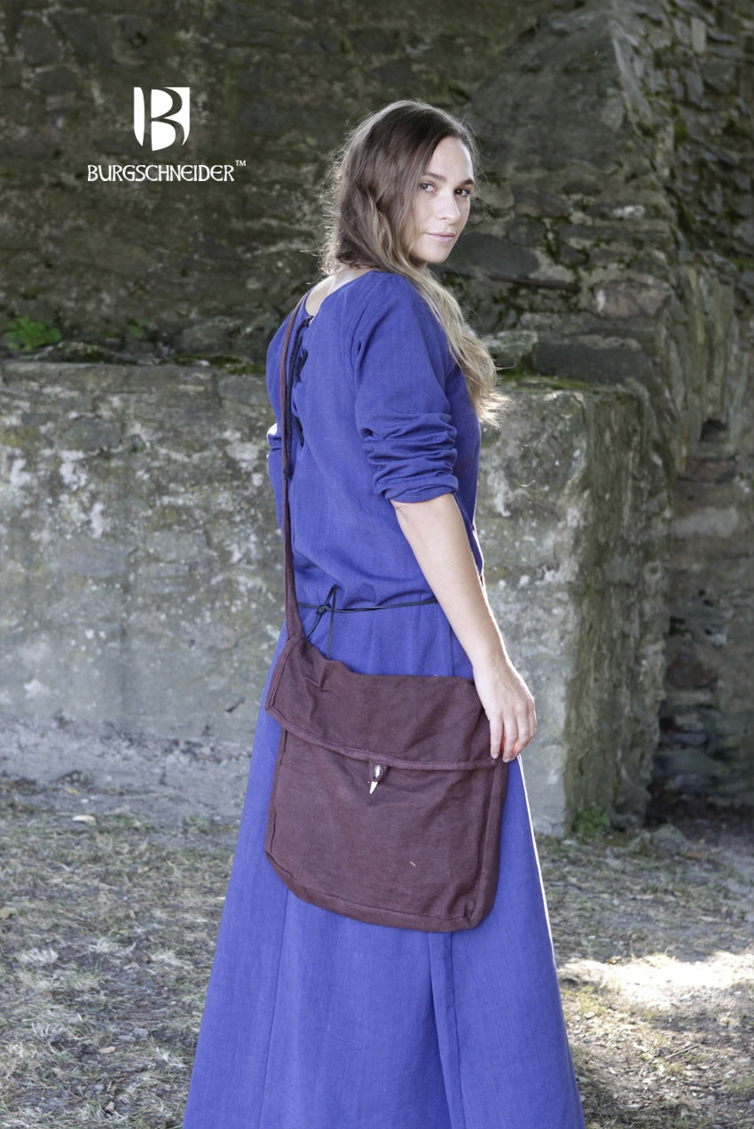 The Bag Ehwaz Brown, a medieval-style bag made of unkempt cotton, featuring a long strap and coarse texture for authenticity.