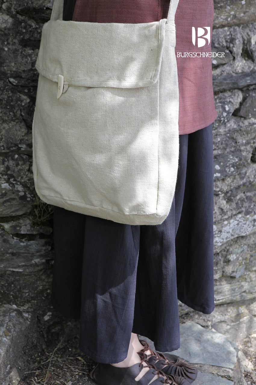 The Bag Ehwaz Hemp, a medieval-style bag made of unkempt cotton, featuring a long strap and coarse fabric for authenticity.