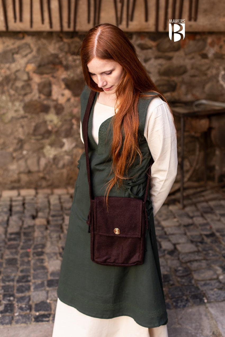 Stylish small shoulder bag in brown wool felt with copper spiral decoration and inner pocket.