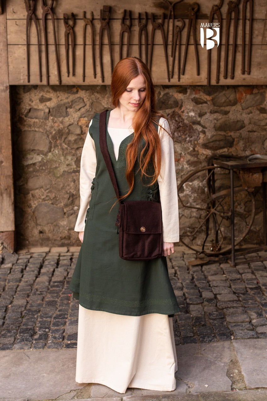 Stylish small shoulder bag in brown wool felt with copper spiral decoration and inner pocket.