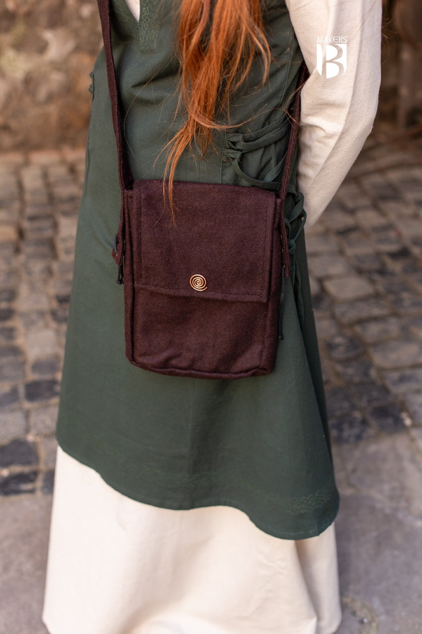 Stylish small shoulder bag in brown wool felt with copper spiral decoration and inner pocket.