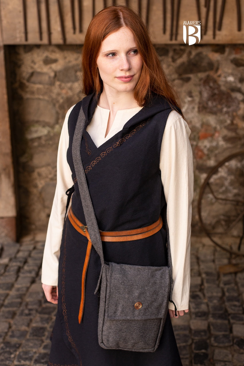 A stylish dark grey shoulder bag made of wool felt, featuring a copper spiral head decoration and a comfortable shoulder strap.