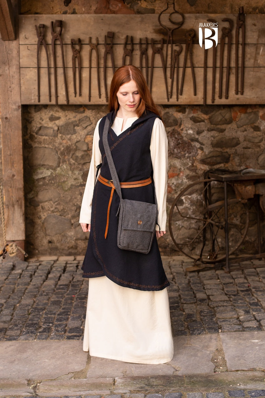 A stylish dark grey shoulder bag made of wool felt, featuring a copper spiral head decoration and a comfortable shoulder strap.