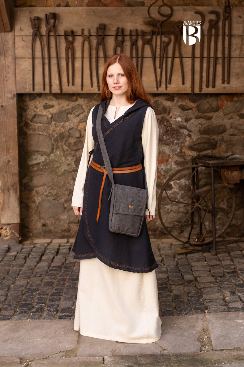 A stylish dark grey shoulder bag made of wool felt, featuring a copper spiral head decoration and a comfortable shoulder strap.