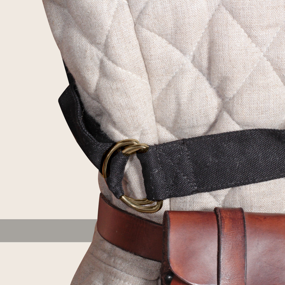 A black bandage belt with 12 gauze bandages, featuring a D-ring closure for adjustable fit, ideal for LARP and wound care.